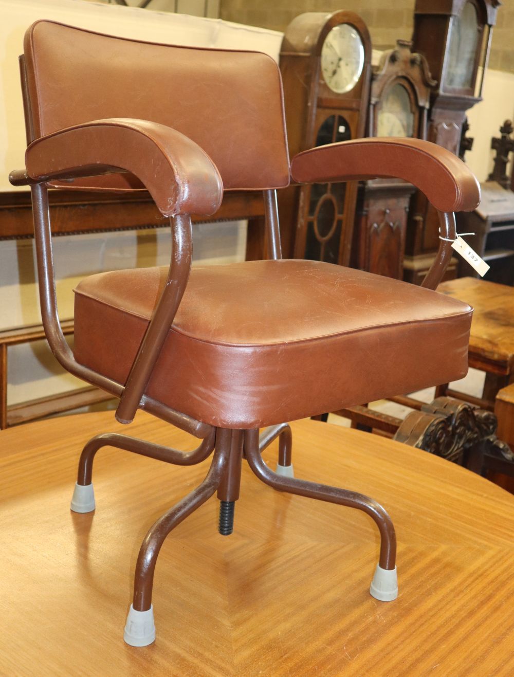 A 1950s adjustable leatherette desk chair
